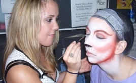M3 Makeup team member applying cats makeup