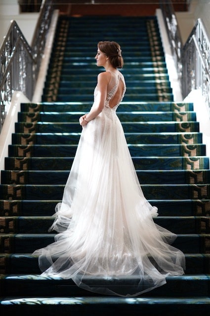 Bride posing on grand staircase