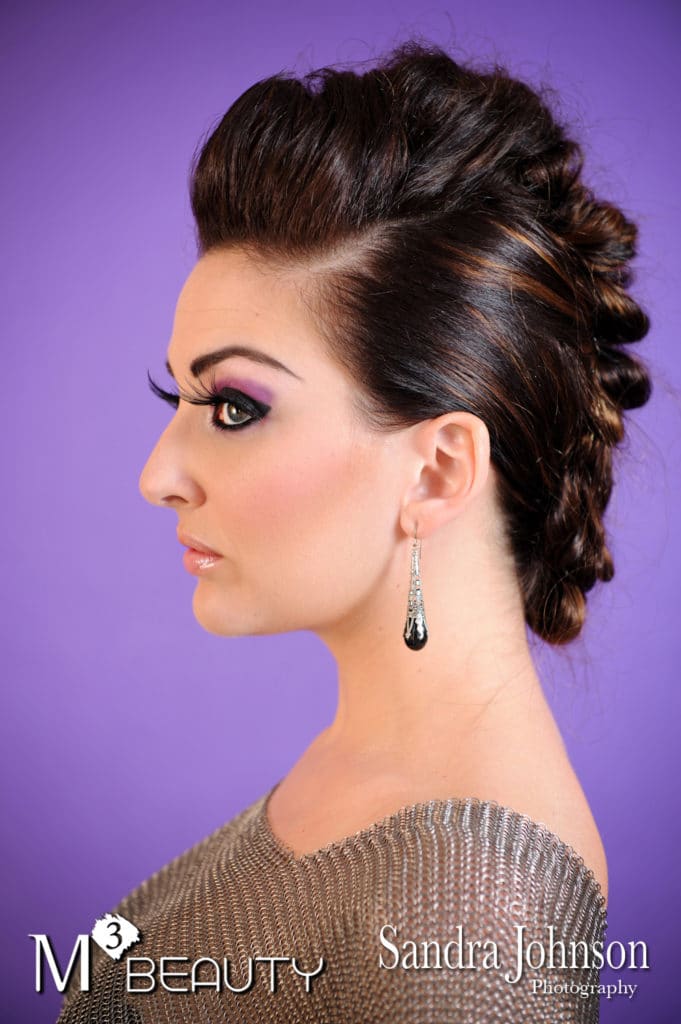 woman with stylish updo and purple eyeshadow