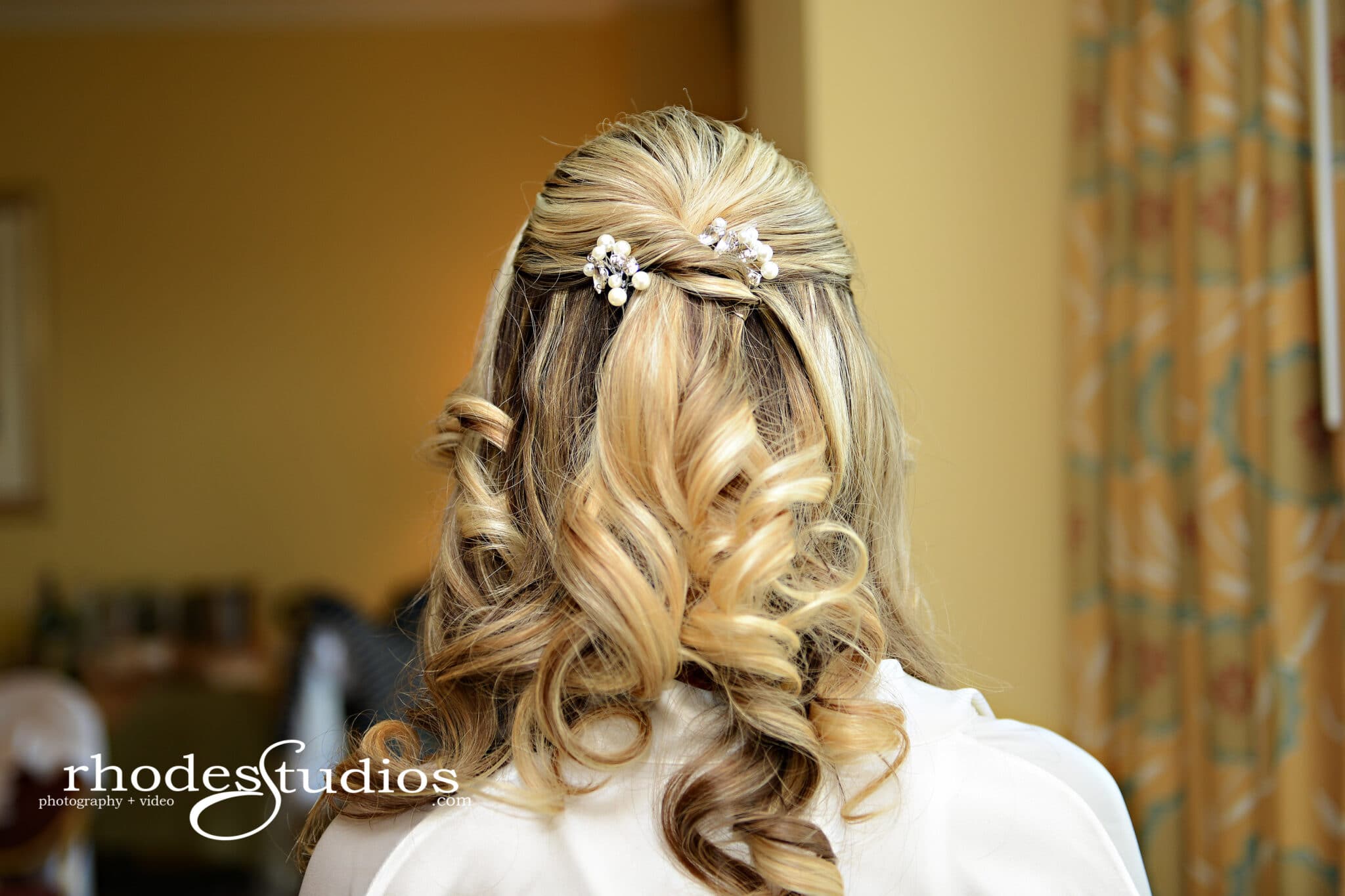 Bride's hairstyle with pearl accent pieces