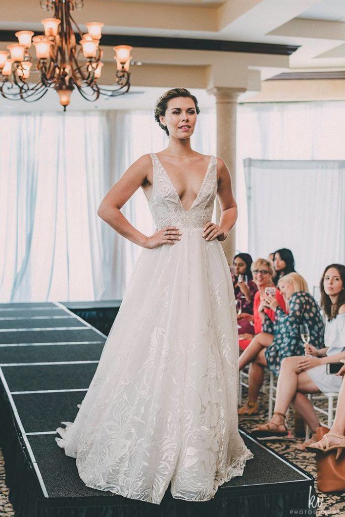 model wearing wedding dress on runway
