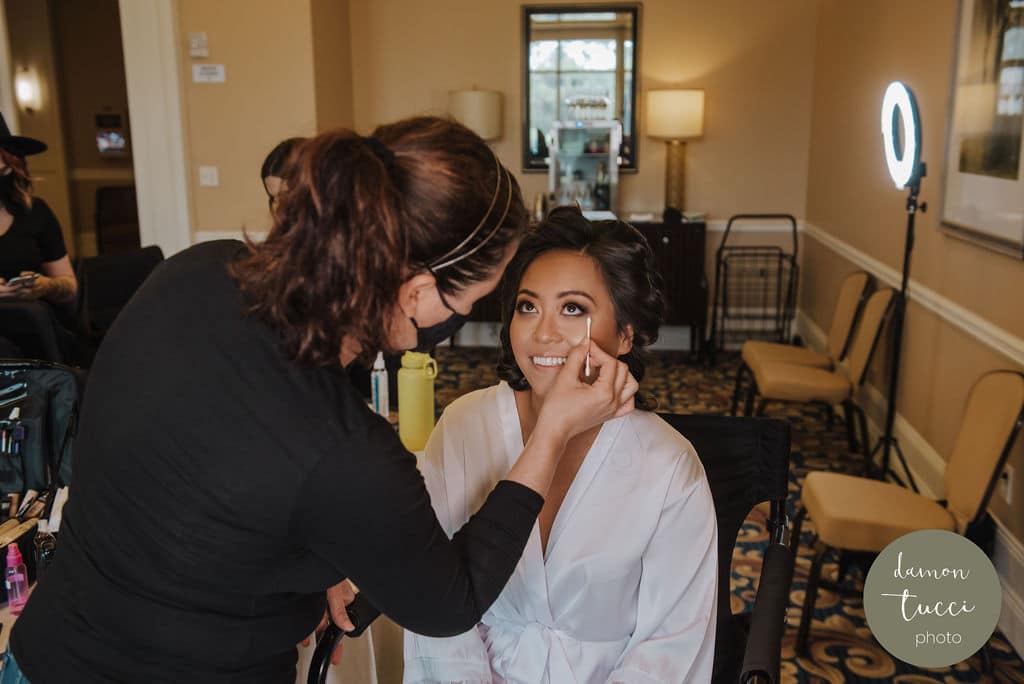A bride having her makeup done.