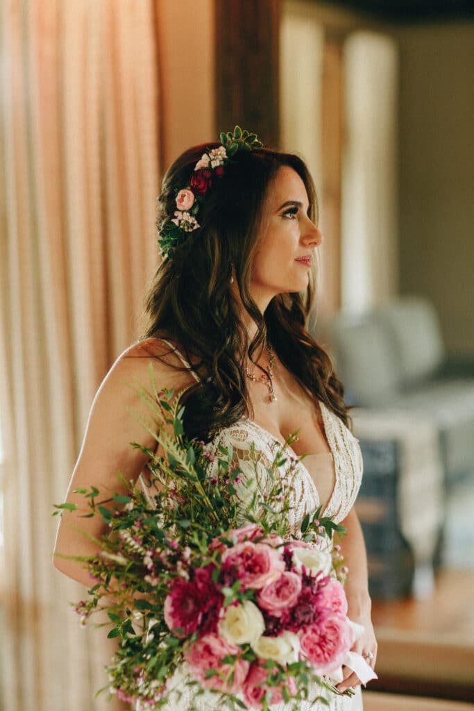 Brides poses with her bouquet
