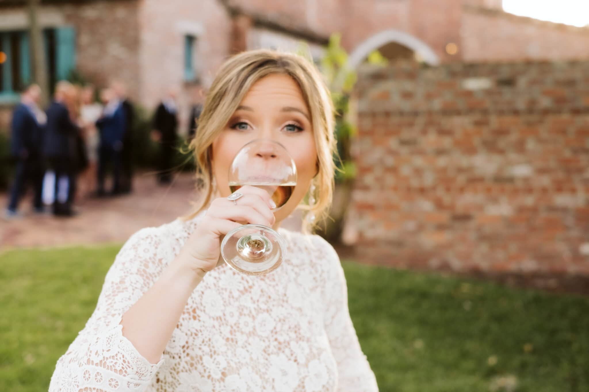 Bride drinking wine