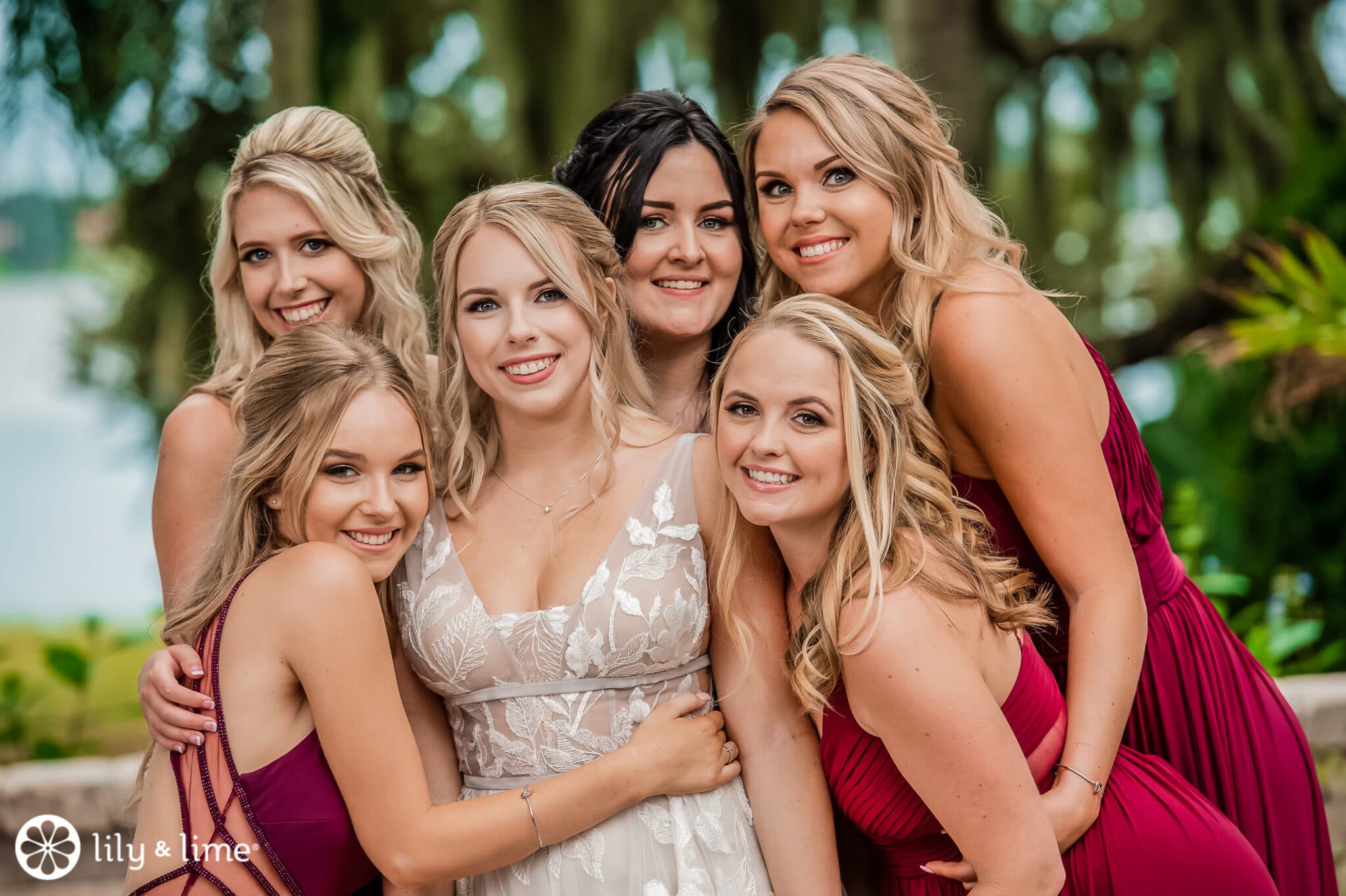 Bride with her bridesmaids. The bridesmaids are dressed in red