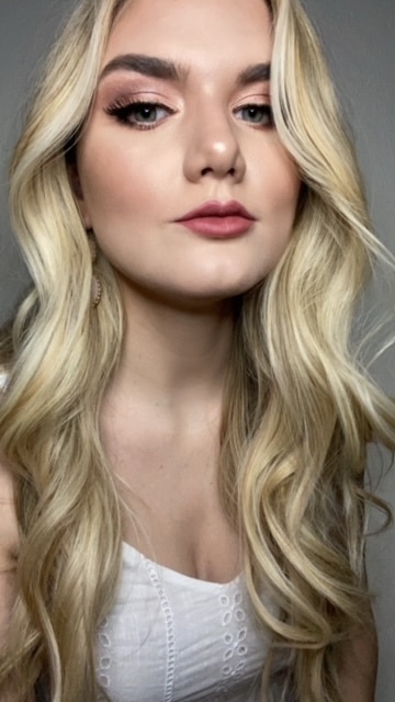 Close up of woman with long blonde hair.