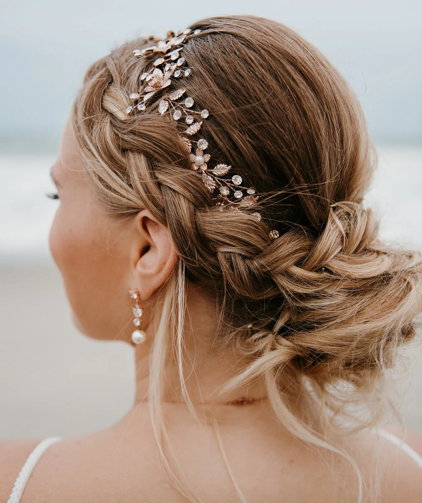 bridal updo hairstyle hair accessories m3 beauty orlando - Wedding Makeup and Hair Gallery Elegant bridal updo hairstyle with braided details and rose gold leaf hair accessories featuring pearls and crystals, created by M3 Beauty wedding hair and makeup artists in Orlando Florida