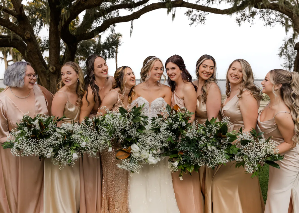 orlando wedding hair makeup bridal party neutral dresses bouquets - Wedding Makeup and Hair Gallery Orlando wedding bridal party with hair and makeup by M3 Beauty featuring bride and bridesmaids in neutral champagne dresses holding white and green bouquets under oak tree