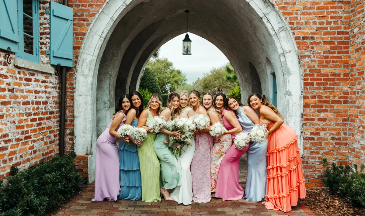 orlando wedding hair makeup bridesmaids m3 beauty - Wedding Makeup and Hair Gallery Orlando wedding bridesmaids in colorful dresses with professional hair and makeup by M3 Beauty posing under brick archway with white bouquets