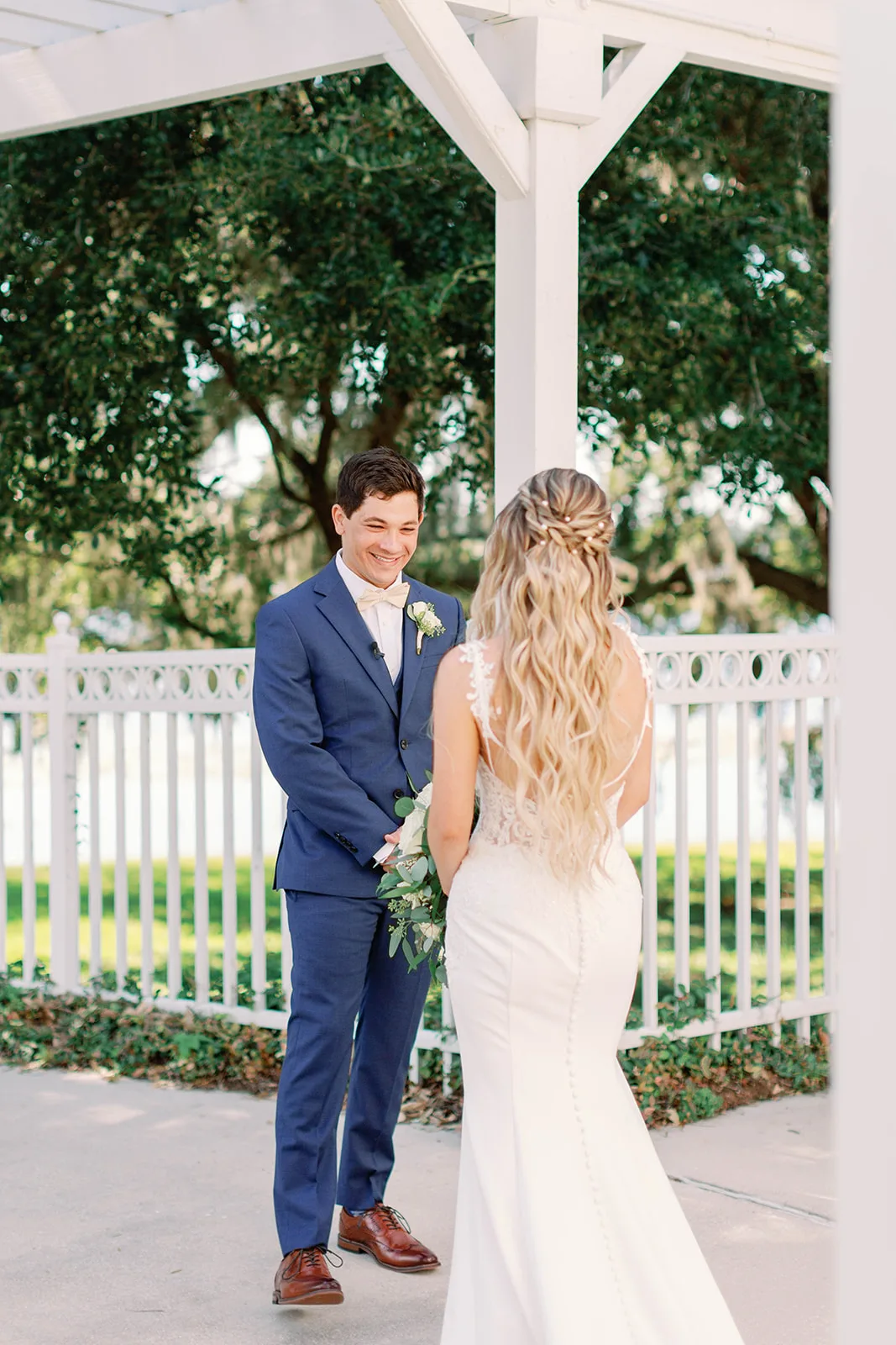 wedding hair makeup orlando bridal updo half up hairstyle m3 beauty - Wedding Makeup and Hair Gallery Bride with romantic half-up braided hairstyle and flowing blonde waves during first look moment at Orlando wedding venue, hair and makeup by M3 Beauty